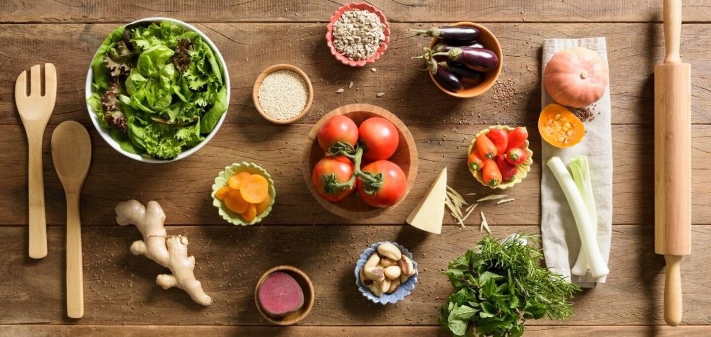 A photo of a kitchen counter with various ingredients and tools arranged neatly, ready for cooking.